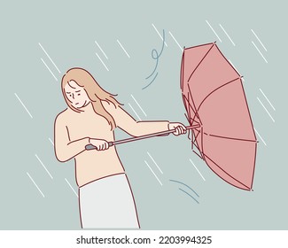 A woman holding an umbrella in heavy rain.Hand drawn style vector design illustrations.