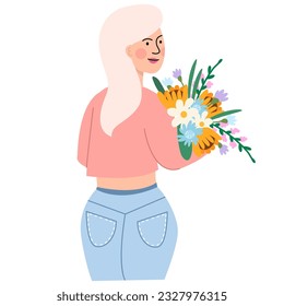 A woman holds a bouquet of flowers in her hands. Concept for the Mother's day, Valentine's day, March 8, women's day. 