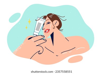 Woman holds cosmetic cream in tubes and calls for use of rejuvenating gel to get rid of wrinkles on face. Young girl with bare shoulders wants to do rejuvenating face mask after shower