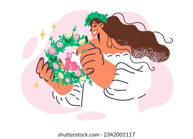 Woman holds easter wreath of spring herbs with rabbit and colorful eggs for festive ritual. Catholic girl with wide smile demonstrates easter attributes to decorate house or gifts to relatives