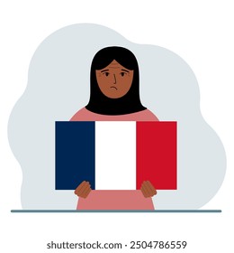 A woman holds a French flag in his hands. The concept of demonstration, national holiday or patriotism. Nationality.
