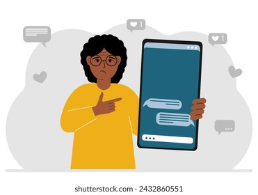 A woman holds a mobile phone with correspondence and SMS messages in his hand.