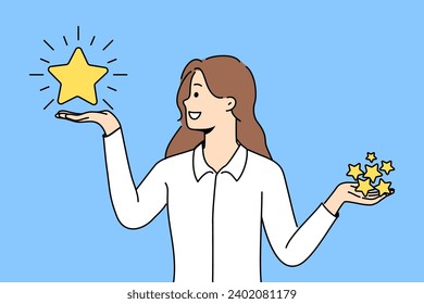 Woman holds rating stars in hands and chooses what rating to give to restaurant on website with reviews. Smiling girl in libra pose encourages you to evaluate your user experience with company