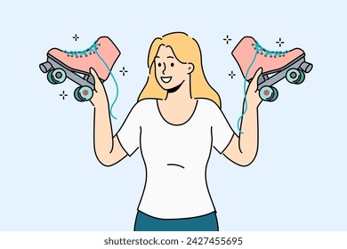 Woman holds retro roller skates, inviting you to ride together in park in fresh air. Smiling girl with vintage shoes with wheels in hands recommends buying roller skates for active lifestyle