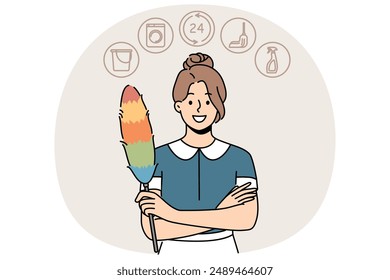 Woman housekeeper or maid with dust brush smiles and looks at screen recommending contacting cleaning company. Maid girl provides services for cleaning apartment or hotel rooms and washing clothes