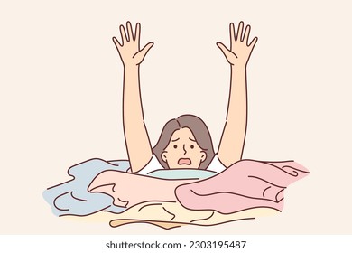 Woman housewife is drowning in dirty laundry and screaming raising hands for concept of household chores and burnout. Young girl housewife among linen waiting to be washed or ironed