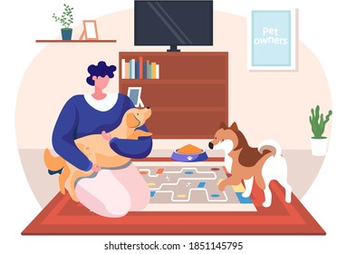 A woman hug her dog with warmth and love, the concept of the relationship between humans and their pets. Female sitting on the floor in livingroom with her domestic animals at home together