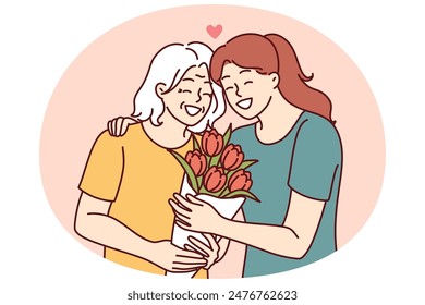 Mujer abraza a madre anciana y da ramo de flores felicitando con cumpleaños o día de la madre y gracias por la buena crianza. Hija adulta cuida de madre en edad de jubilación