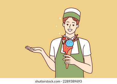 Woman ice cream seller holds cold dessert in waffle cup offering fruit delicacy to refresh after walk. Girl waiter in apron demonstrates ice cream to satisfy hunger in hot summer weather 