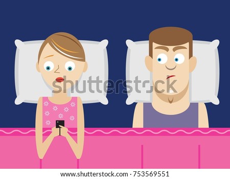 Woman ignoring husband while using phone in bed