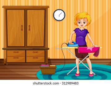 Woman ironing clothes in the house