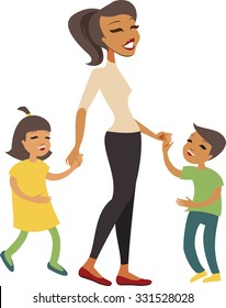 Woman and kids holding hands while walking