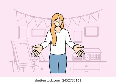 Woman kindergarten teacher invites small children, standing in room with easel and toys. Happy girl working in kindergarten or primary school greetingly puts arms to sides to hug kids