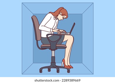 Woman with laptop sits in cardboard box typing article working in cramped office of small company. Young girl office worker is inconvenienced due to lack of free space in workplace