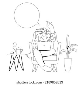A woman with a laptop sits in a chair.
