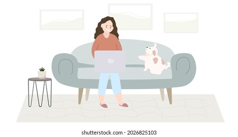 A woman with a laptop is sitting on a sofa with a dog. Home interior.