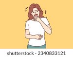 Woman laughs out loud and clutches stomach after hearing new joke on TV show with famous stand-up comedians. Girl laughs hears humorous story from friends or learns about prank on colleagues