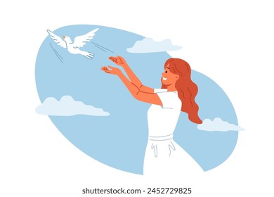 Woman launches dove into sky, symbolizing peace and harmony or hope for better future for people. Dove bird takes off from hands of religious girl, experiencing joy in communicating with animal world