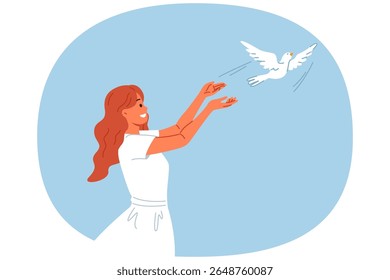 Woman launches dove into sky, symbolizing peace and harmony or hope for better future for people. Dove bird takes off from hands of religious girl, experiencing joy in communicating with animal world