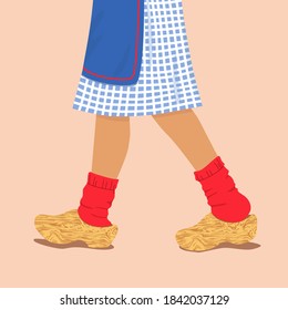 Woman legs in wooden dutch clogs. Female feet in traditional holland shoes, red woolen socks and national folk costume. Flat vector cartoon culture klomp illustration
