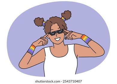 Woman with LGBT bracelets adjusts sunglasses and smiles, drawing attention to problems of LGBTq community. African American girl fight against discrimination against lesbian and LGBT activists