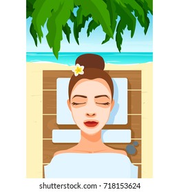 Woman lies in cosmetic mask, cream, under the towel gets skin treatment, SPA care. Girl with closed eyes gets salon procedure in summer tropic, on a beach side, resort.