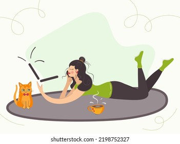 A Woman Lies On The Floor At Home And Works On A Laptop. The Girl Is Resting With A Cat And A Cup Of Coffee. Freelancer Lady Or Female Student Chatting, Watching Online Video With Pet. Cartoon Vector