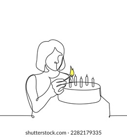 woman lighting candles on a cake - one line drawing vector. the concept of preparing a cake for the holiday, celebrating a birthday alone without friends