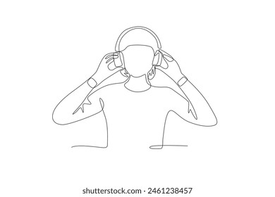 Woman listening to music from headphones