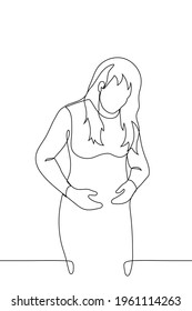 woman with long hair touches her belly with both hands - one line drawing vector. pregnancy concept, slimming process and belly reduction, menstrual pain