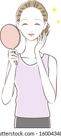 Woman looking at the mirror and smiling
