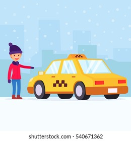 Woman looking for a taxi in city. Winter time