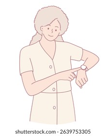 A woman looks thoughtfully at her watch, which indicates her effective time management and attentive nature