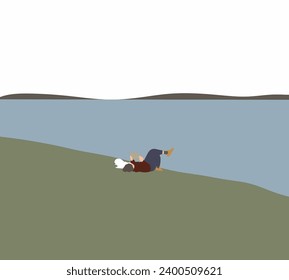 Woman lying near river with cute dog reading book outdoors on summer day. Enjoying her time alone. Leisure in Nature.