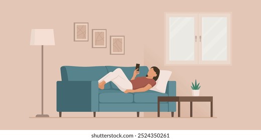 Woman lying on the couch at home, she is relaxing and connnecting online with her smartphone