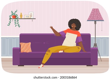 Woman lying on sofa in apartment. Happy young girl relaxing, dreaming. Rest on couch and think about something. Home leisure. Female lies on divan and smiles, enjoying time at home after work