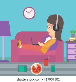 Woman lying on sofa with many gadgets.