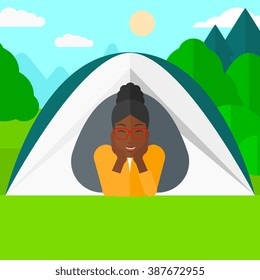 Woman lying in tent.