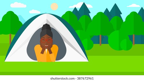 Woman lying in tent.