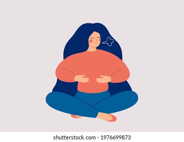 Woman makes Breathing exercise. Girl sits on the floor in pose lotus and makes a deep Inhalation. Recovery Respiratory system after illness. Health and wellbeing concept. 