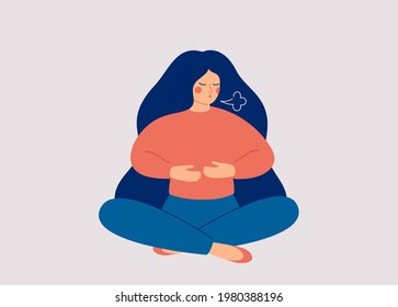 Woman makes Breathing exercise. Girl sits on the floor in pose lotus and makes a exhale. Recovery Respiratory system after illness. Health and wellbeing concept. 