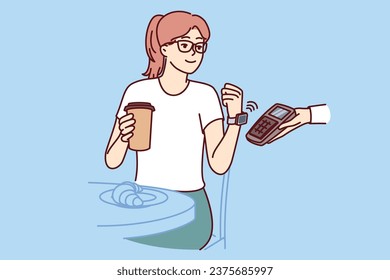 Woman makes contactless payment with smart watch, applying gadget with NFC chip to POS terminal in hand waiter from cafe. Girl has breakfast in restaurant and drinks coffee, making payment