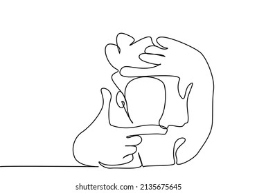 a woman makes film frames and focus marks with her hand and fingers