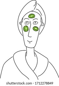 a woman makes a kiwi face mask