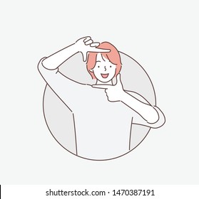 Woman making a hand frame. Hand drawn style vector design illustrations.