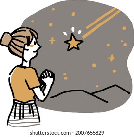 A woman making a wish to a shooting star
