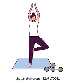 woman making yoga with mat and dumbbells