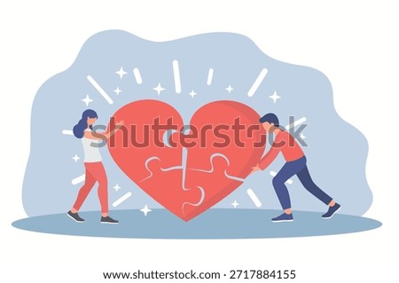 A woman and a man assembling heart shaped puzzle. A couple working on their relationship.