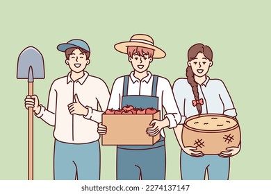Woman and man dressed as farmers smiling rejoicing at harvest or good sales at organic food agricultural fair. People working in agricultural sector with grown products and shovel in hands 