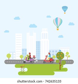 Woman and man driving scooter across the city and park